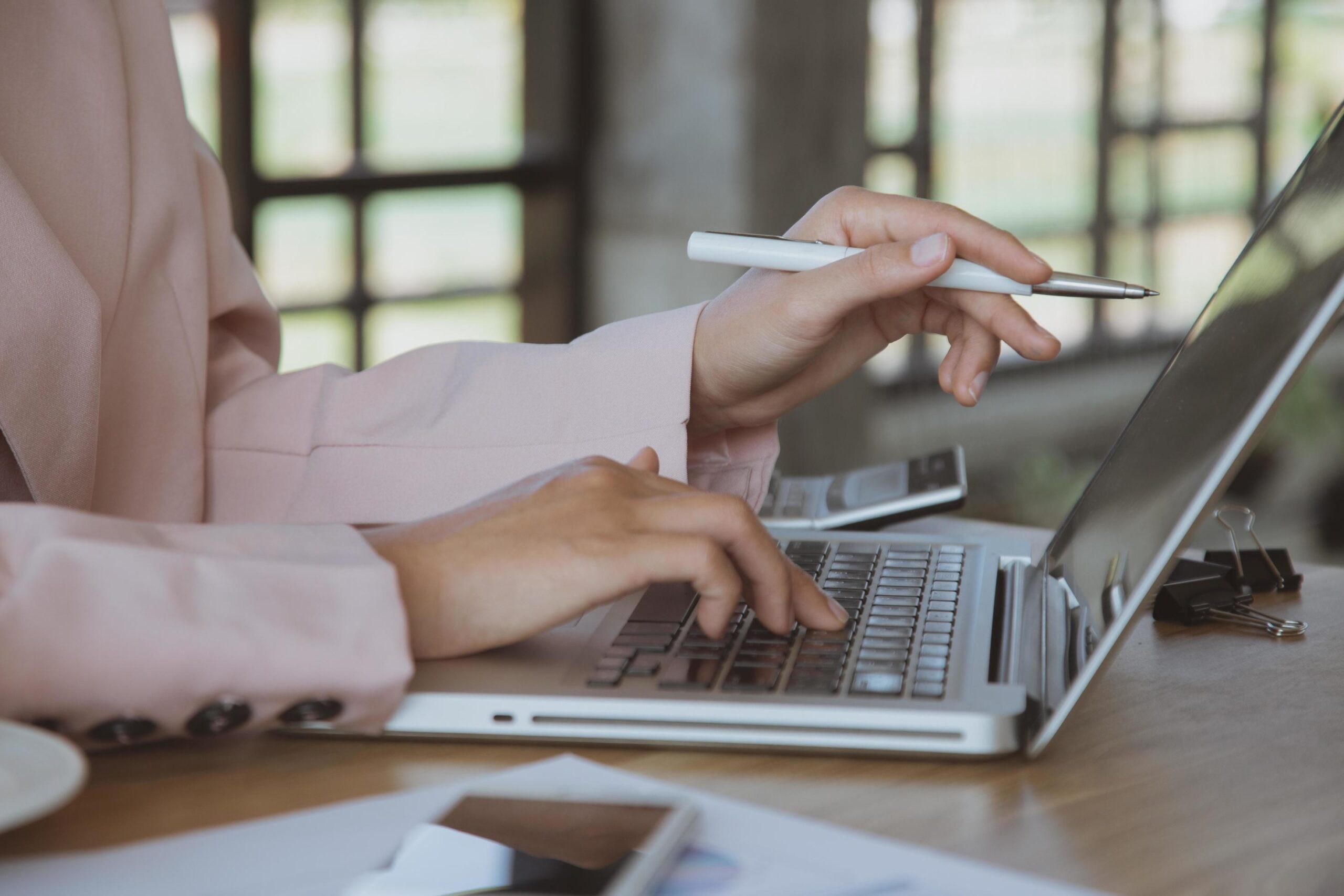 https://smartwebconsulting.com/wp-content/uploads/2023/07/young-business-woman-working-on-laptop-at-office-free-photo-scaled.jpeg